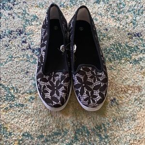 Never worn, black and white flats.